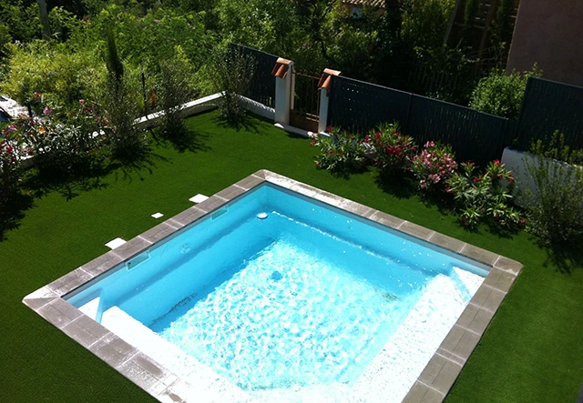 Artificial turf for swimming pools
